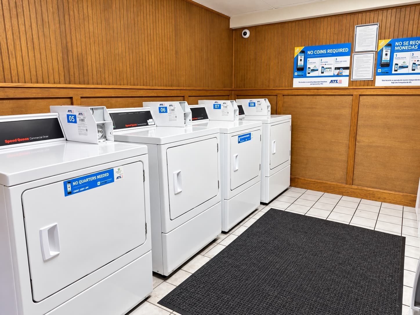 On-site laundry room with commercial washers and dryers