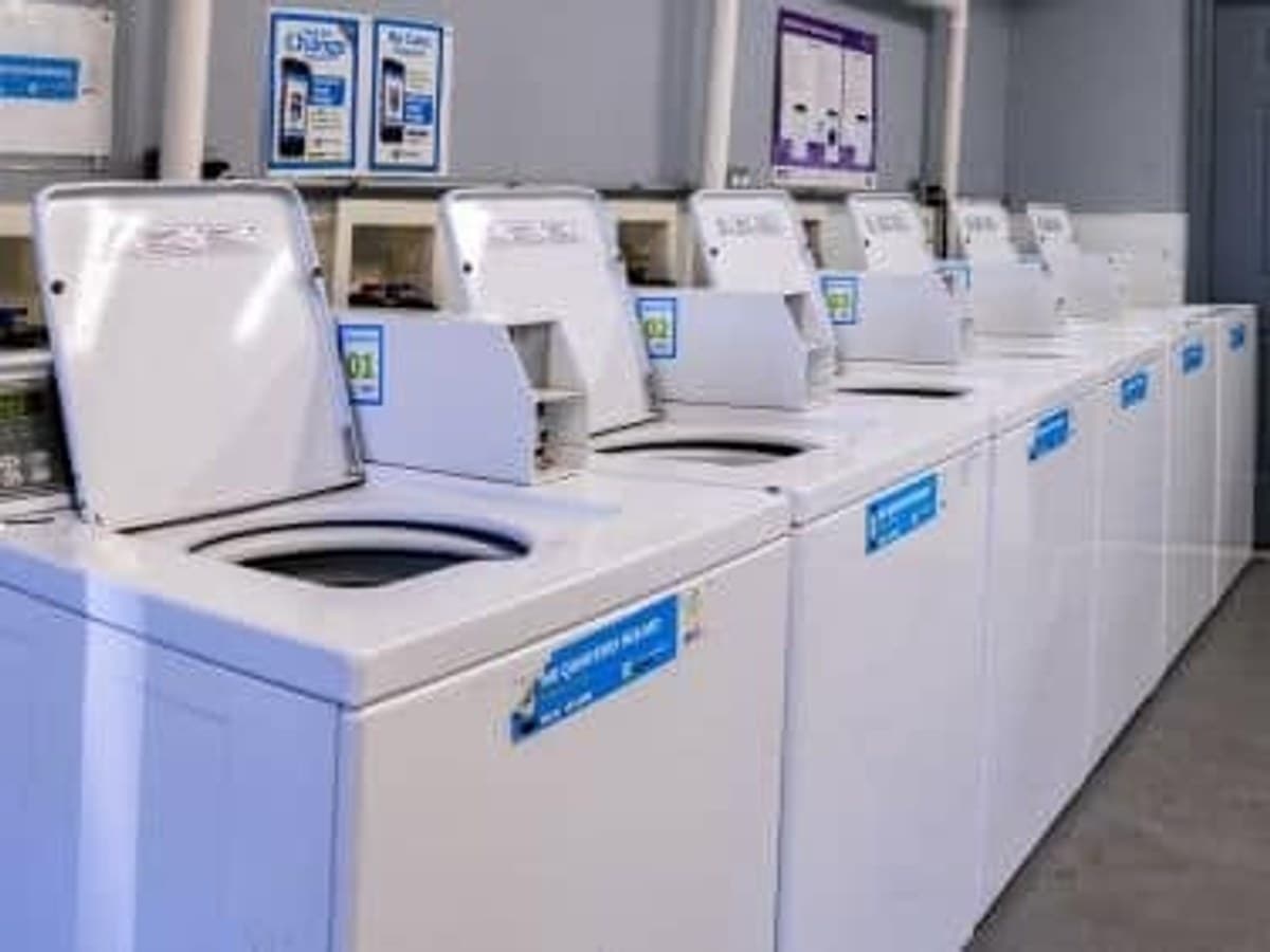 On-site laundry room with commercial washers